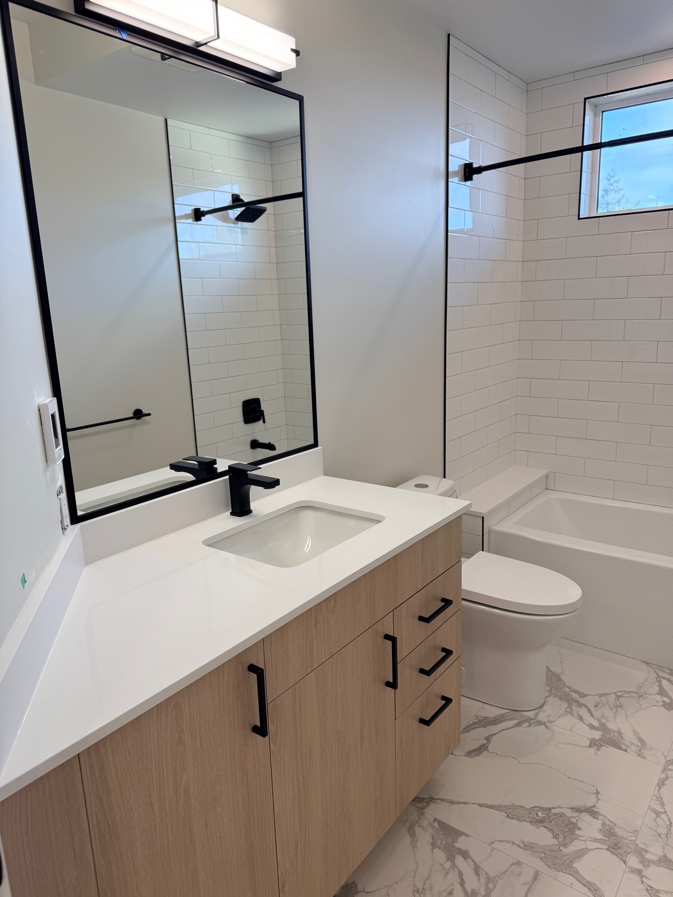 Bathroom with wood vanity after a clean