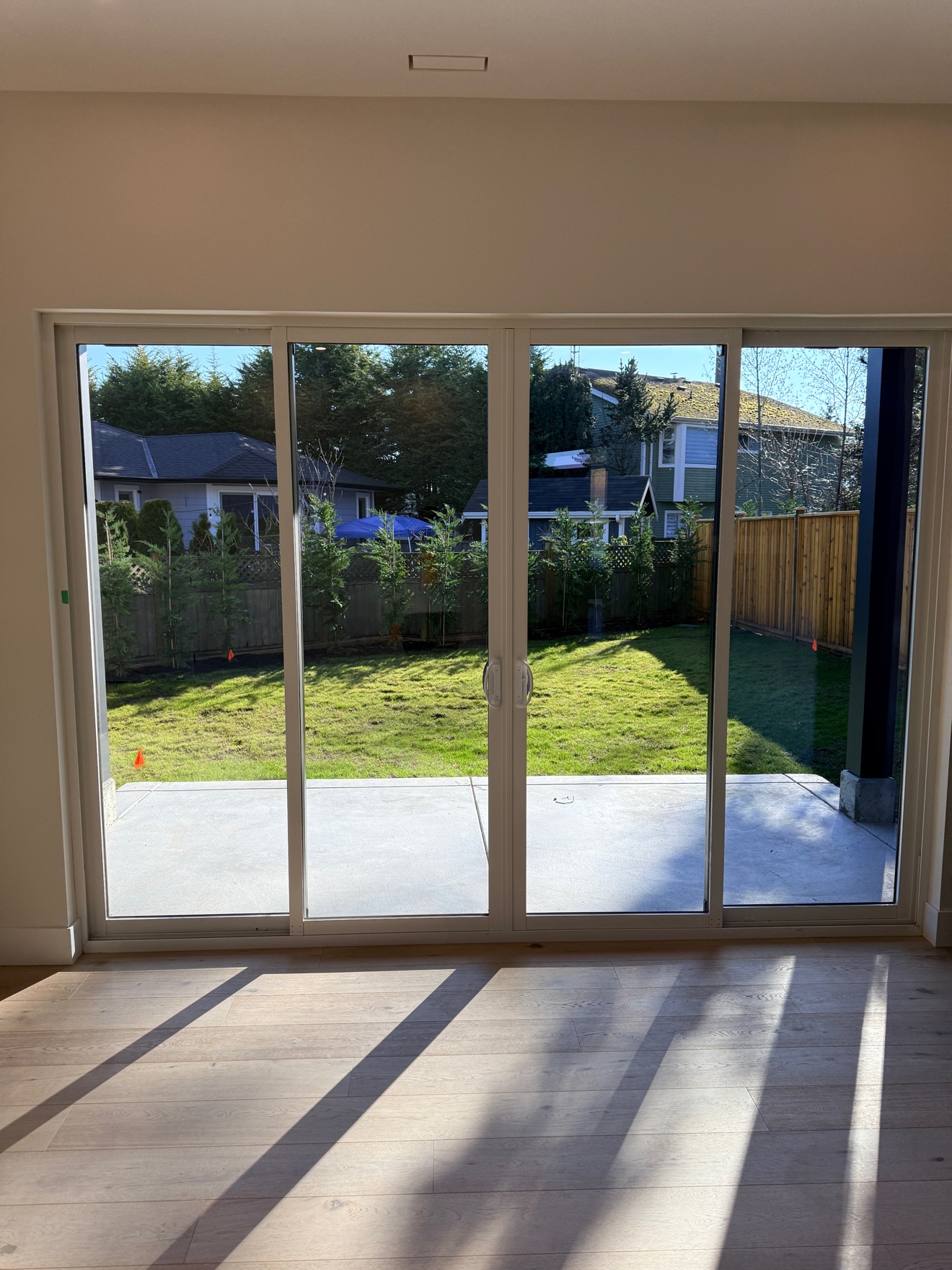 Empty living room with sliding doors after a clean