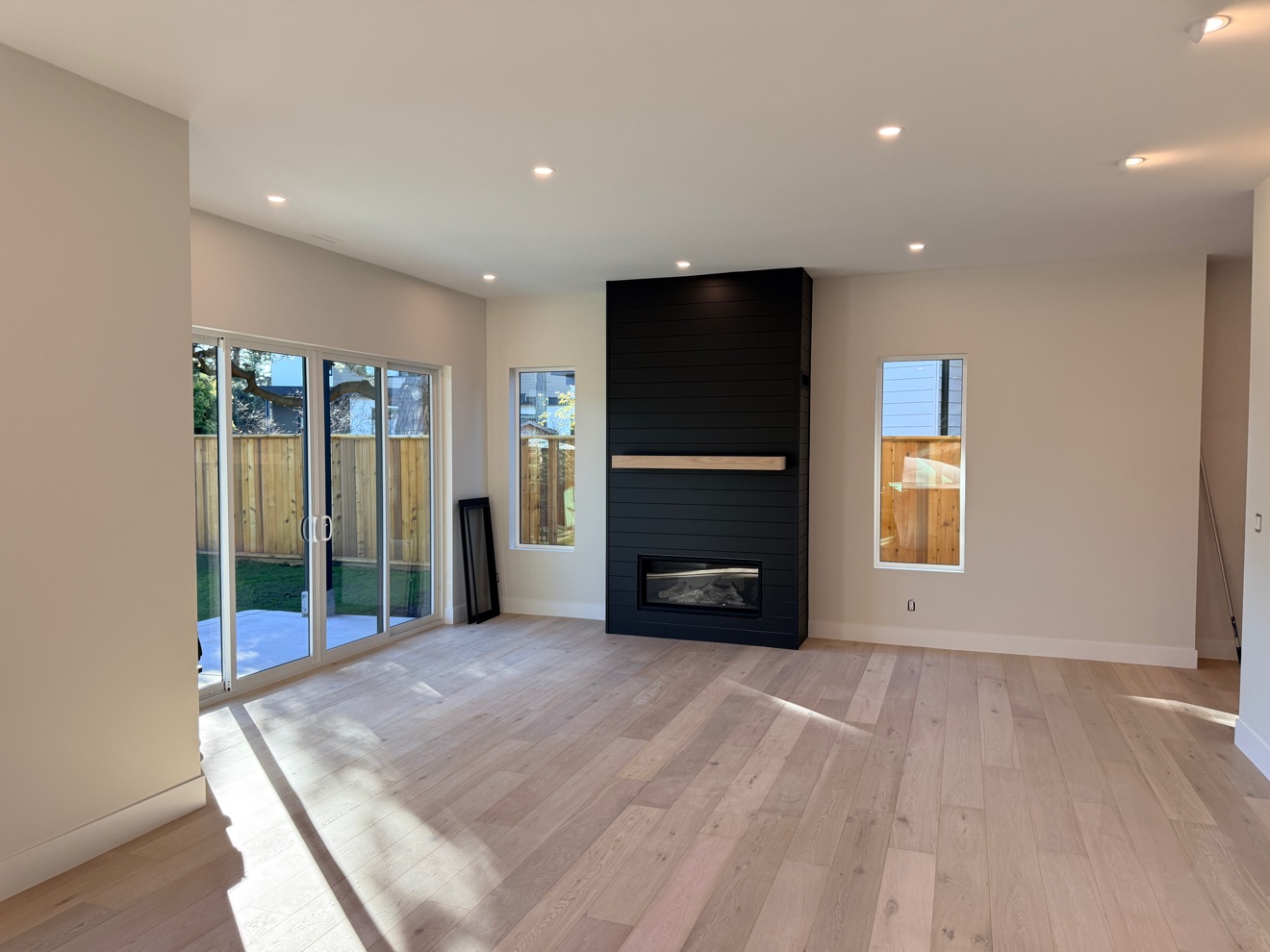 Living room with black fireplace after a clean